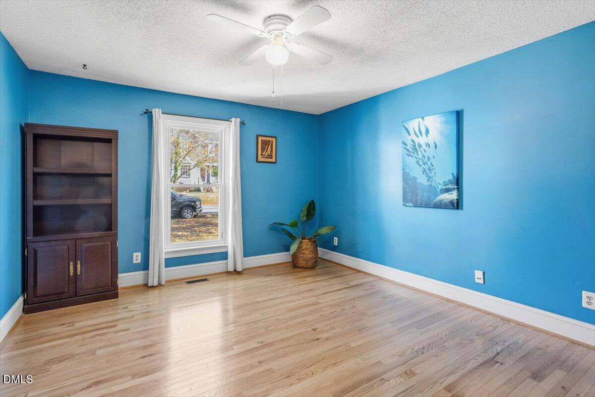 3516 East Jameson Road Raleigh, NC 27604 - Photo 18 of 32 wooden floor in an empty room with a window