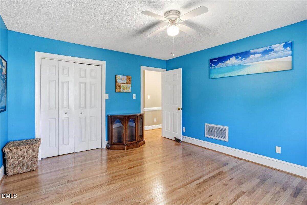 3516 East Jameson Road Raleigh, NC 27604 - Photo 19 of 32 a view of empty room with wooden floor