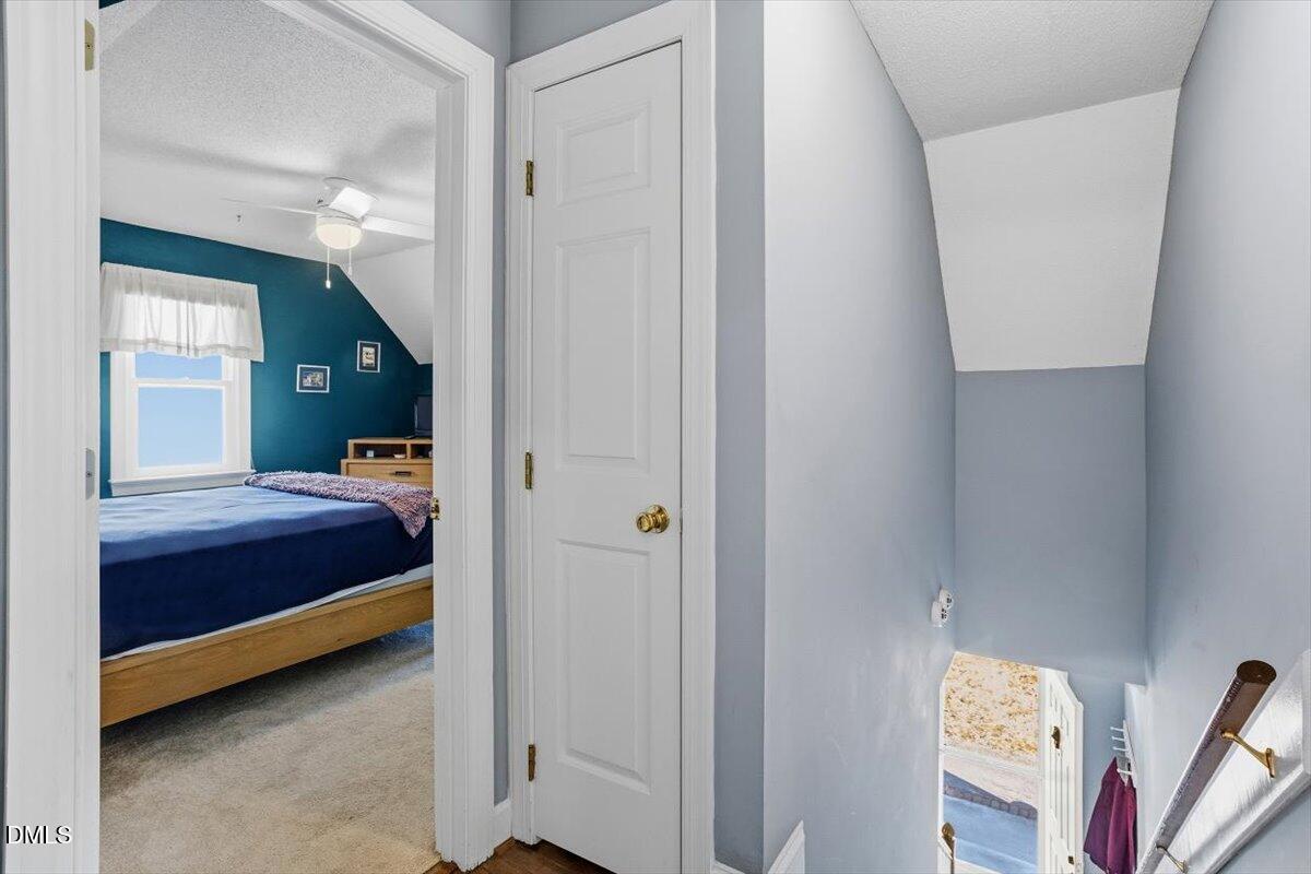 3516 East Jameson Road Raleigh, NC 27604 - Photo 21 of 32 a bedroom with a bed and a cabinets