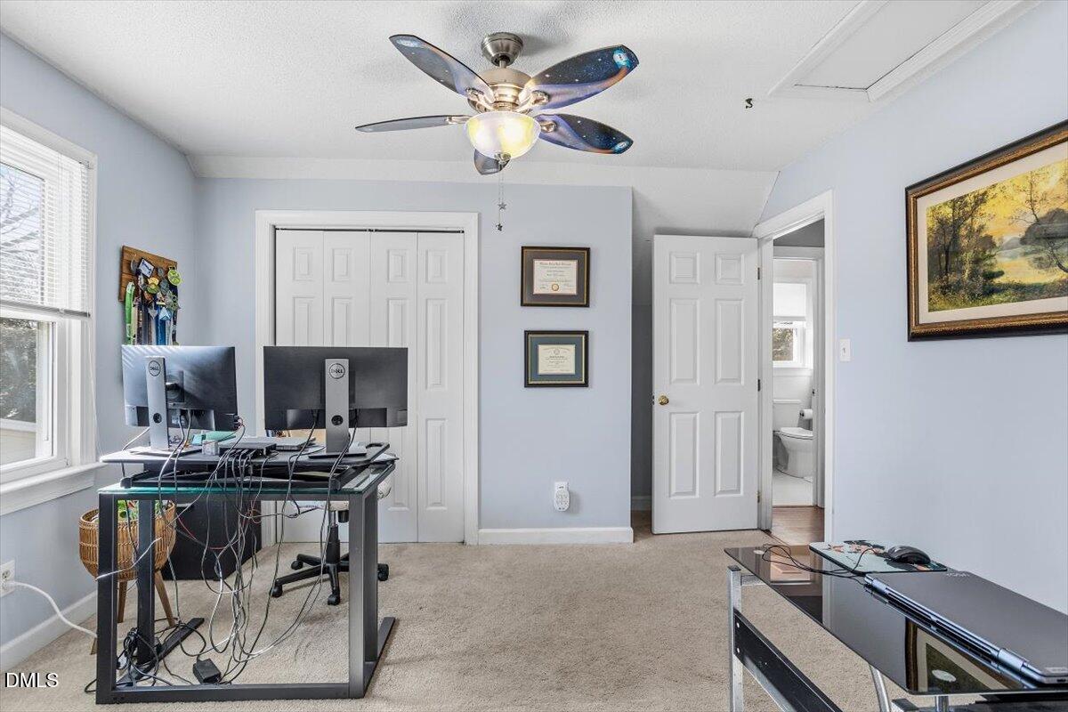 3516 East Jameson Road Raleigh, NC 27604 - Photo 26 of 32 a workspace with furniture a ceiling fan and a window