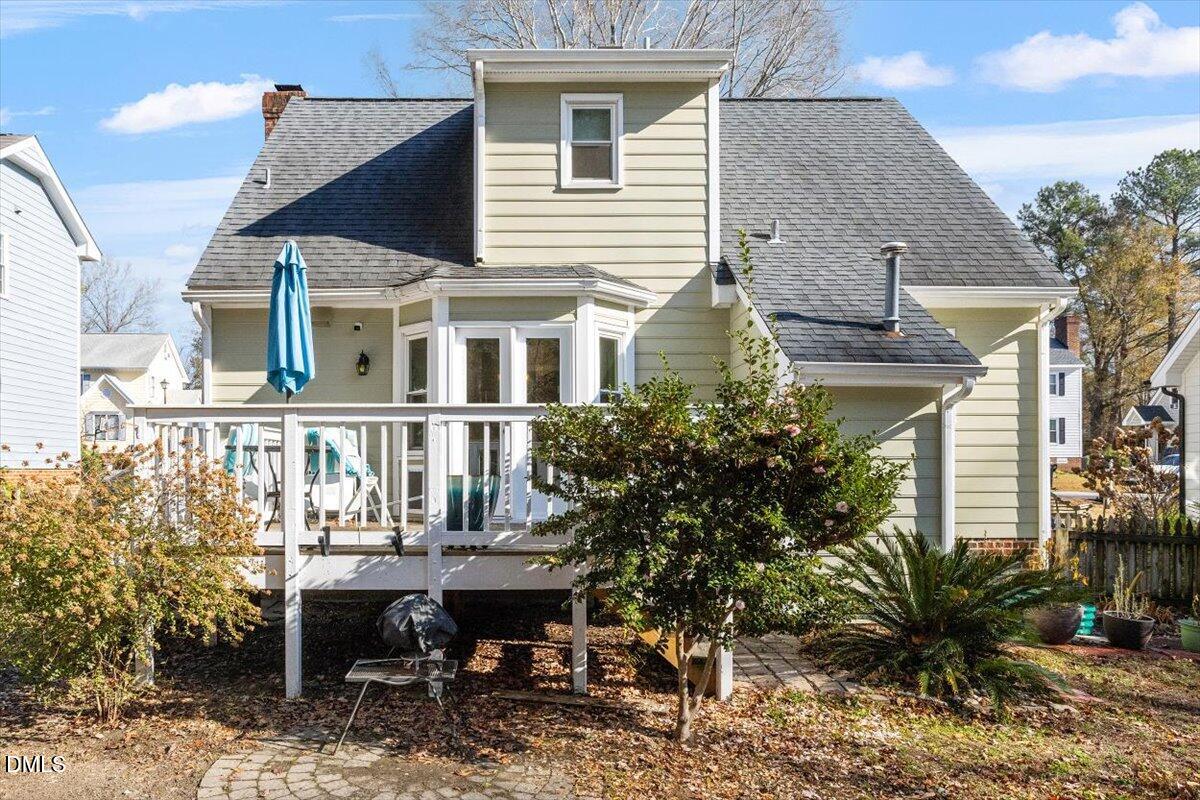 3516 East Jameson Road Raleigh, NC 27604 - Photo 27 of 32 a view of a house with a backyard and sitting area