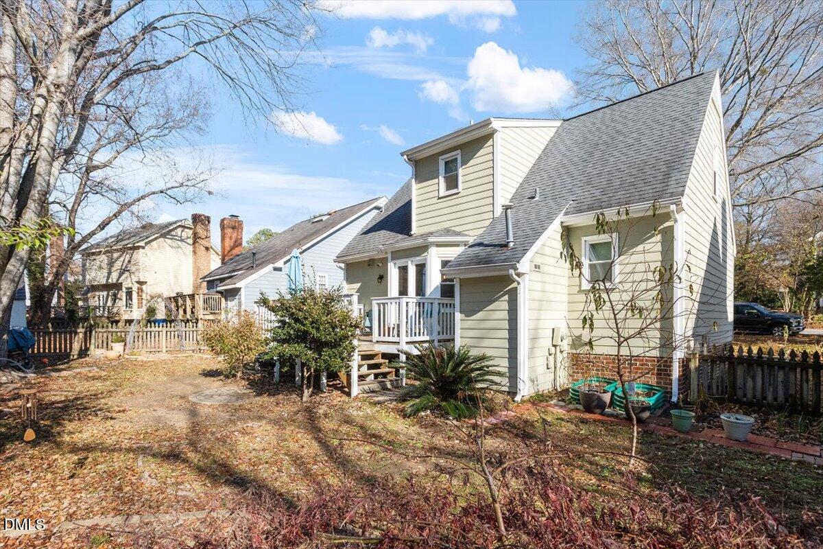 3516 East Jameson Road Raleigh, NC 27604 - Photo 29 of 32 a view of a house with a yard