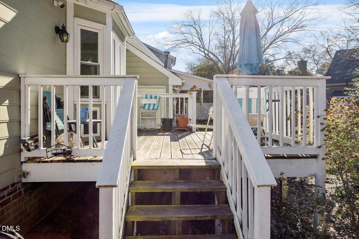 3516 East Jameson Road Raleigh, NC 27604 - Photo 30 of 32 a view of house with wooden floor and a ocean view