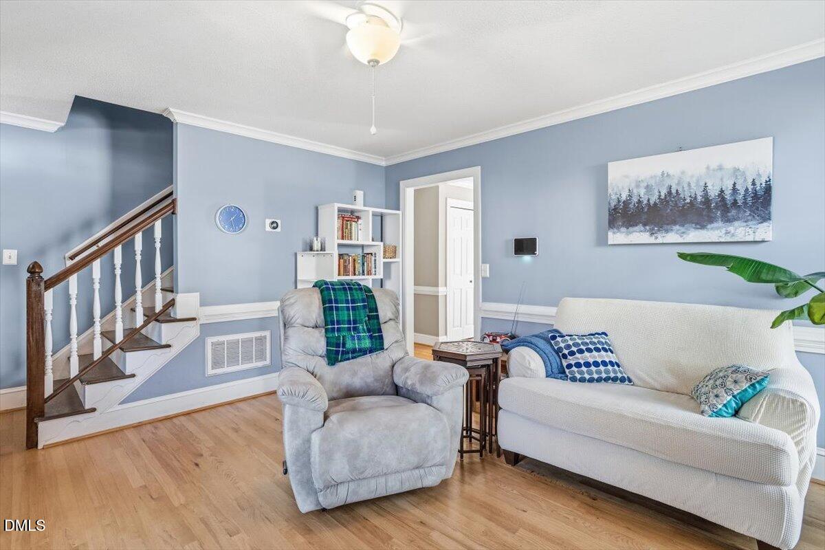 3516 East Jameson Road Raleigh, NC 27604 - Photo 7 of 32 a living room with furniture and a large window