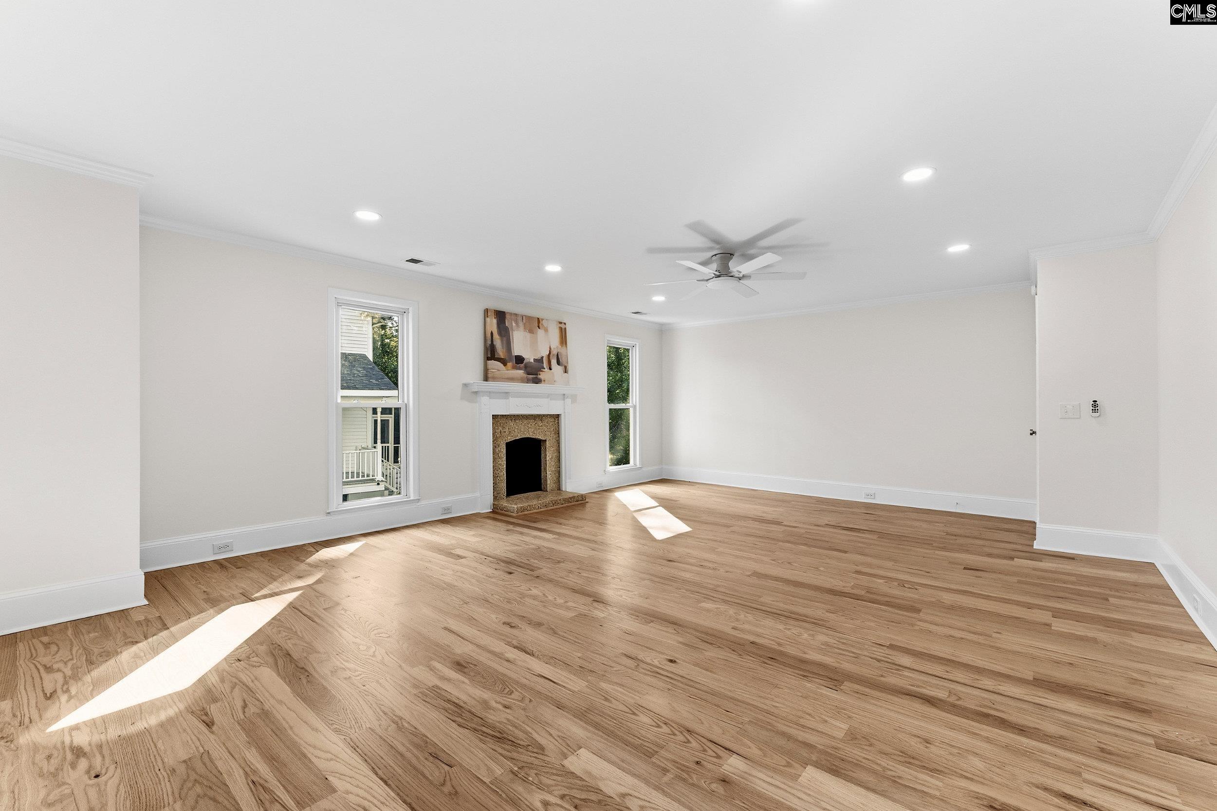 121 Silver Lake Road East Columbia, SC 29223 - Photo 37 of 57 a view of empty room with wooden floor and fireplace