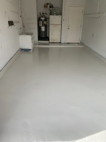 a view of storage and utility room with two washing machine