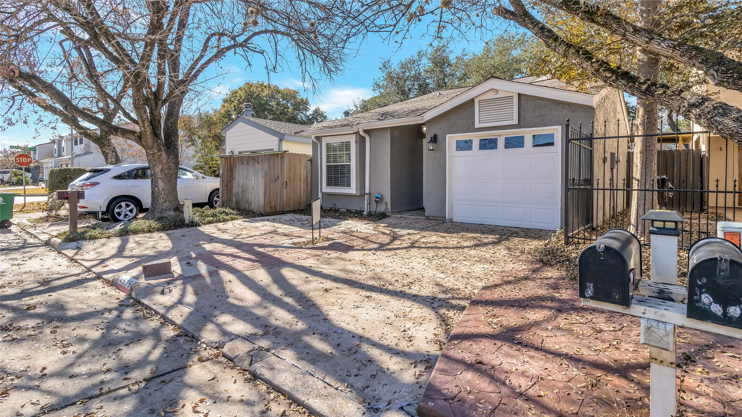 4505 Terrace Manor Drive Houston, TX 77041 - Photo 18 of 19 a view of a house with a yard covered in snow