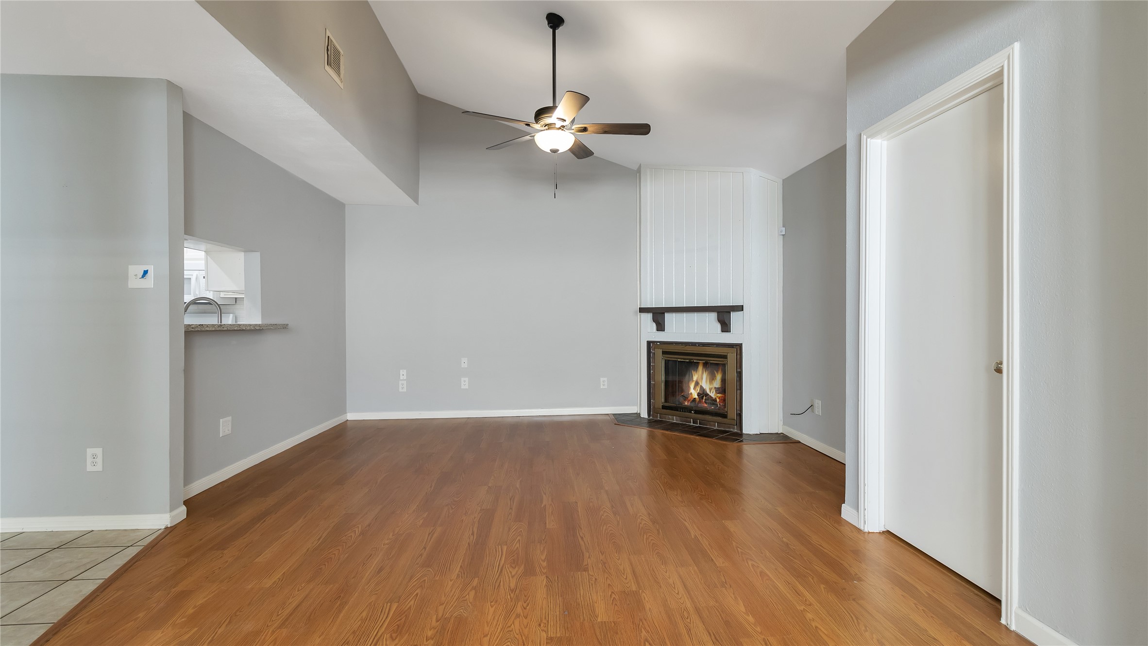 4505 Terrace Manor Drive Houston, TX 77041 - Photo 7 of 19 a view of an empty room with wooden floor fireplace and a window