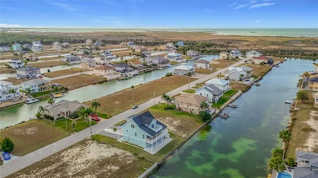 an aerial view of a city with ocean view