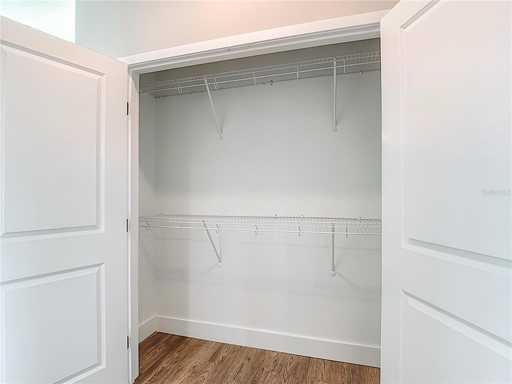 3487 Sheephead Drive Hernando Beach, FL 34607 - Photo 57 of 77 a view of walk in closet with clothes and shoes