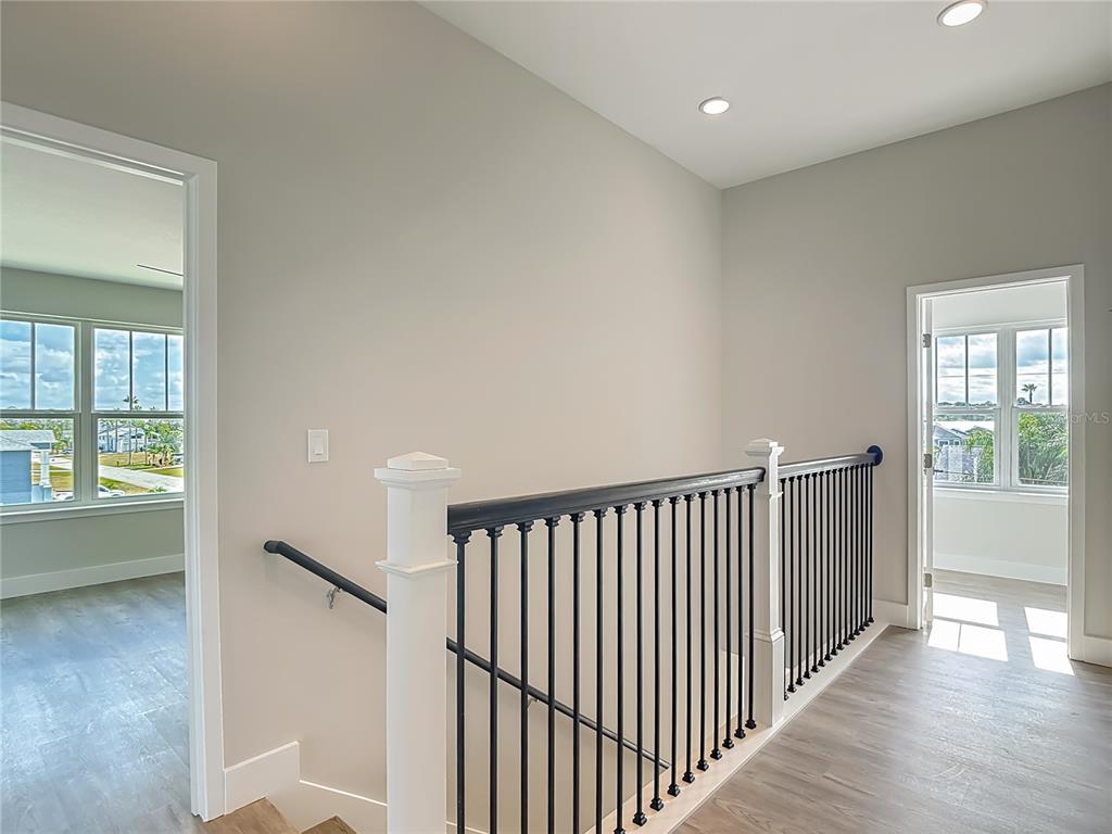 3487 Sheephead Drive Hernando Beach, FL 34607 - Photo 62 of 77 a view of a hallway with windows