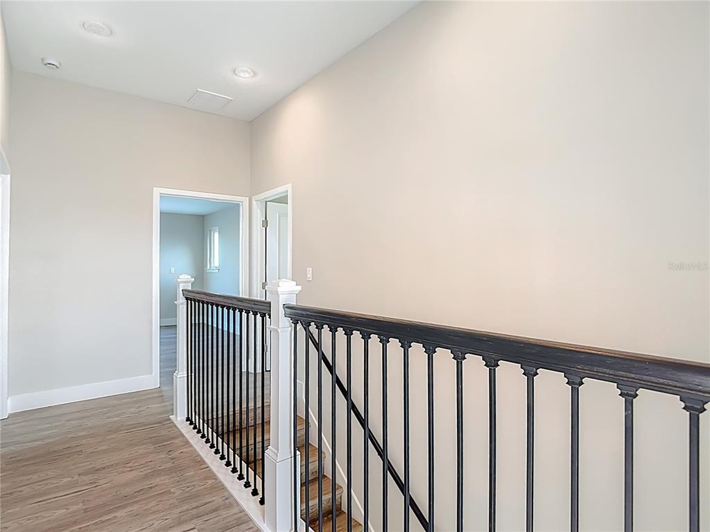 3487 Sheephead Drive Hernando Beach, FL 34607 - Photo 63 of 77 a view of a hallway with wooden floor