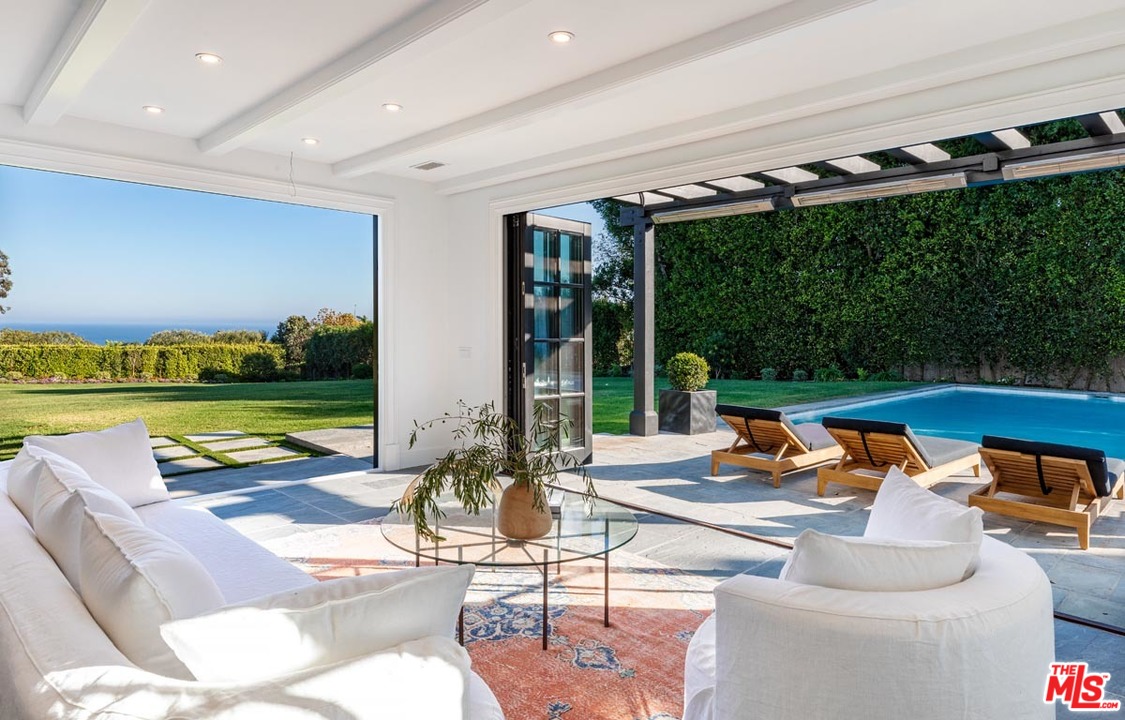 6950 Dume Drive Malibu, CA 90265 - Photo 17 of 24 a outdoor space with patio lots of furniture and garden view