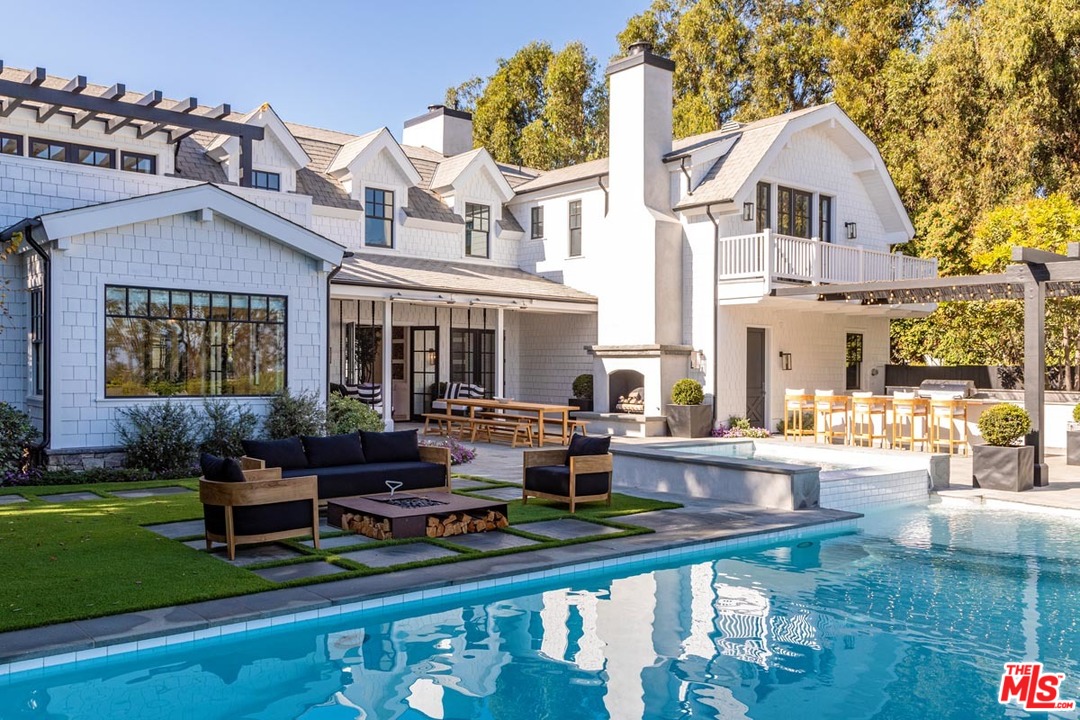 6950 Dume Drive Malibu, CA 90265 - Photo 19 of 24 a front view of a house with garden