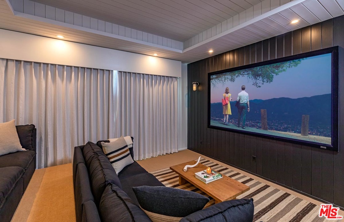 6950 Dume Drive Malibu, CA 90265 - Photo 20 of 24 a room with furniture and screen