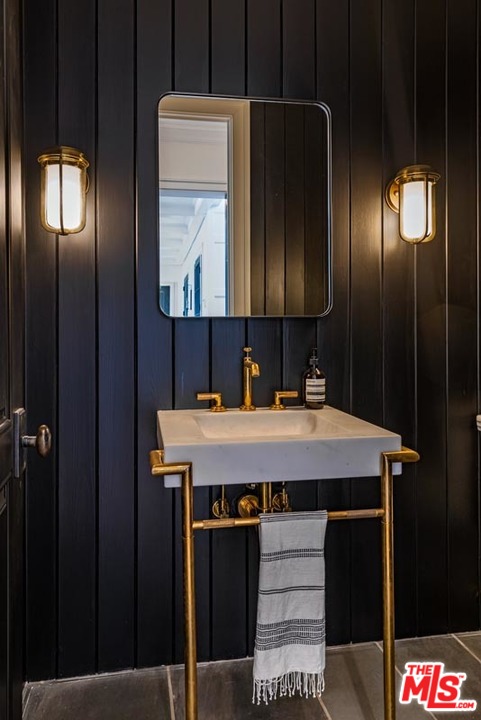 6950 Dume Drive Malibu, CA 90265 - Photo 21 of 24 a bathroom with a sink a shower and a mirror