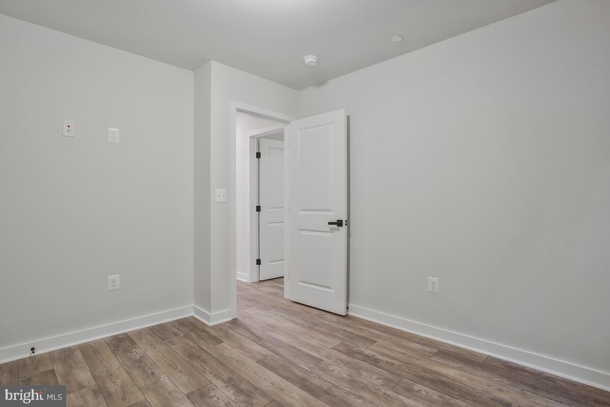 1209 Johnson Drive Shady Side, MD 20764 - Photo 23 of 37 an empty room with wooden floor