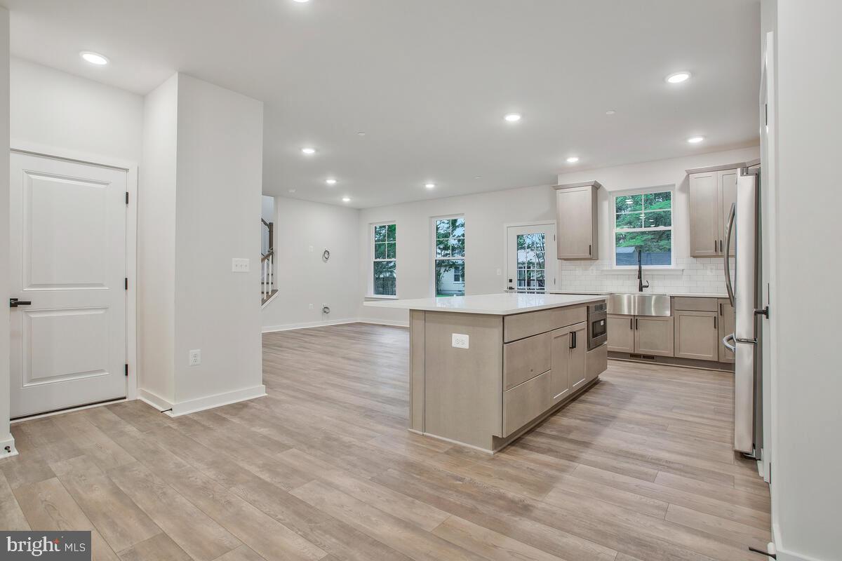 1209 Johnson Drive Shady Side, MD 20764 - Photo 6 of 37 a large kitchen with a lot of counter space and a refrigerator