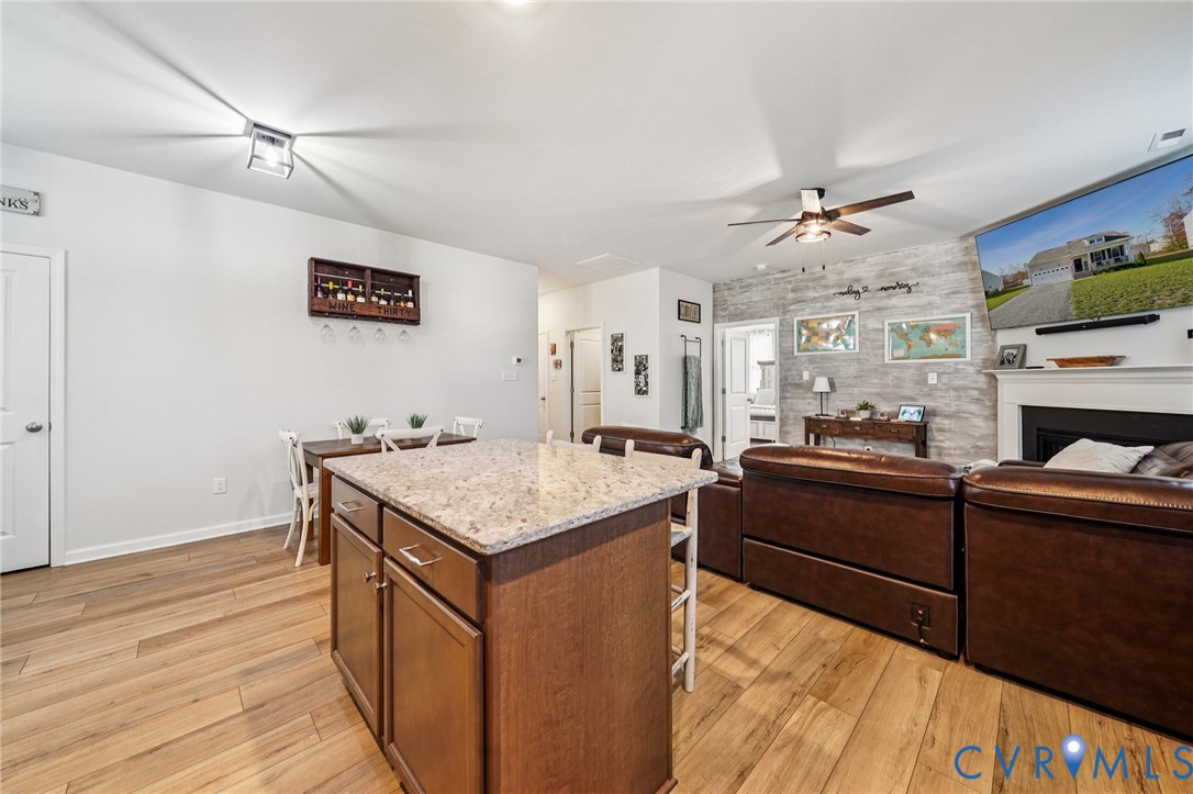 243 Bellevue Circle Aylett, VA 23009 - Photo 11 of 34 a kitchen with cabinets and wooden floor