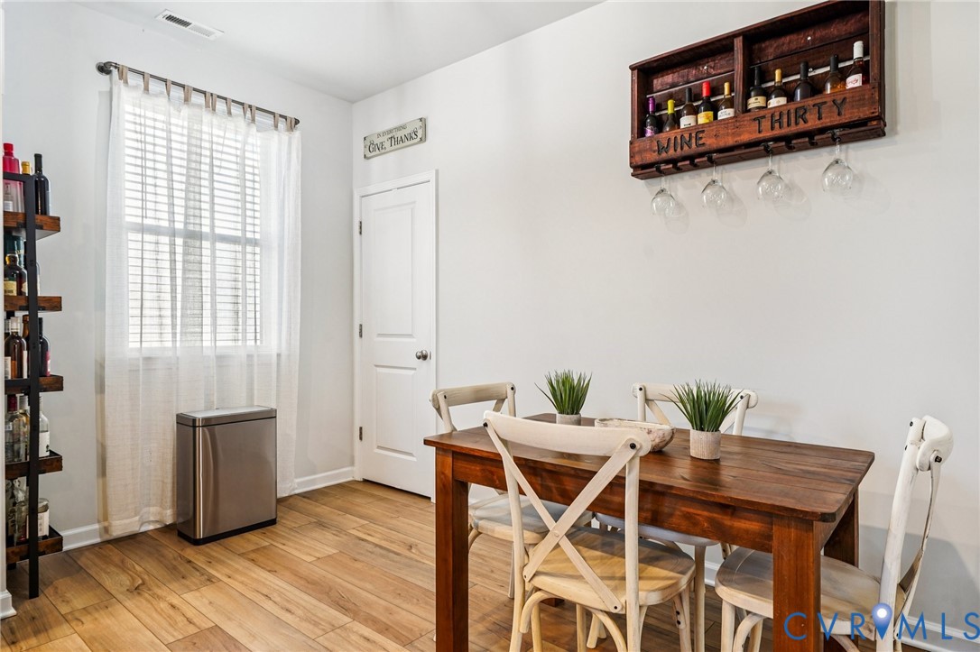 243 Bellevue Circle Aylett, VA 23009 - Photo 12 of 34 a view of a dining room with furniture and wooden floor