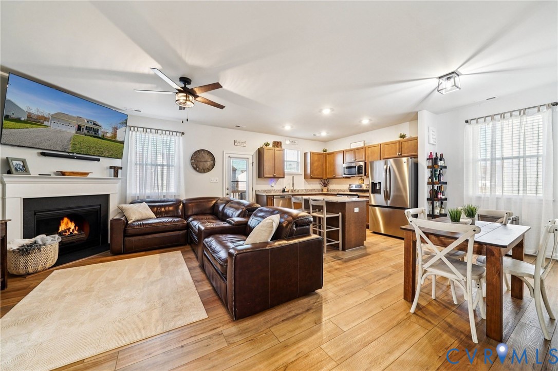 243 Bellevue Circle Aylett, VA 23009 - Photo 14 of 34 a living room with furniture a fireplace and a flat screen tv