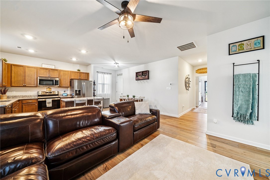 243 Bellevue Circle Aylett, VA 23009 - Photo 16 of 34 a living room with stainless steel appliances furniture and a view of kitchen