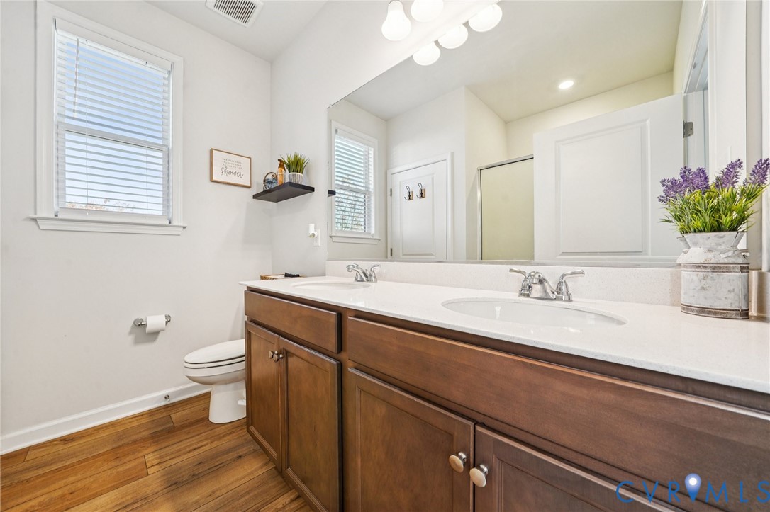 243 Bellevue Circle Aylett, VA 23009 - Photo 20 of 34 a bathroom with a sink a toilet and a mirror