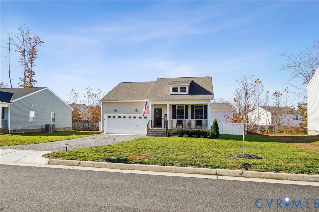243 Bellevue Circle Aylett, VA 23009 - Photo 2 of 34 a front view of a house with a yard