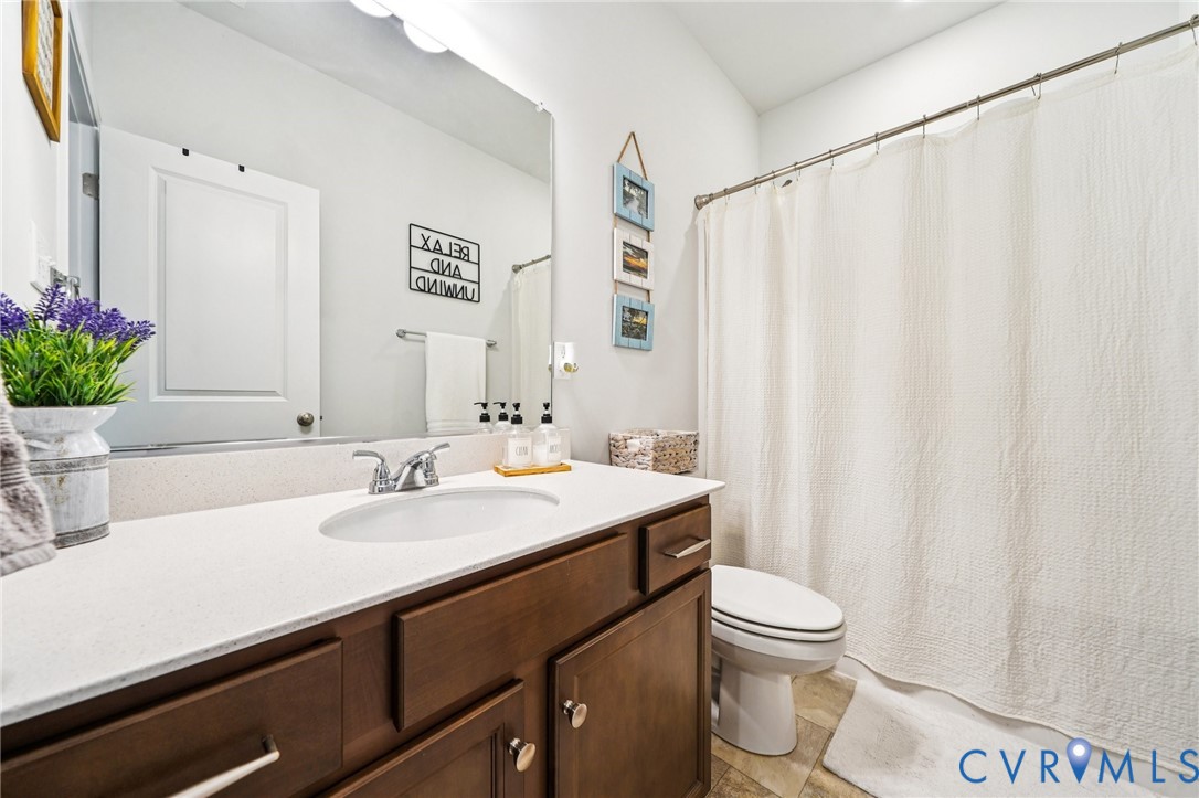 243 Bellevue Circle Aylett, VA 23009 - Photo 23 of 34 a bathroom with a sink a toilet and a mirror