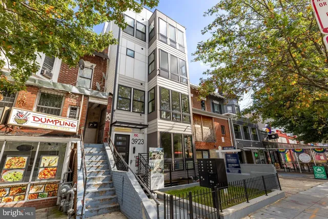 a view of room with painting on the wall