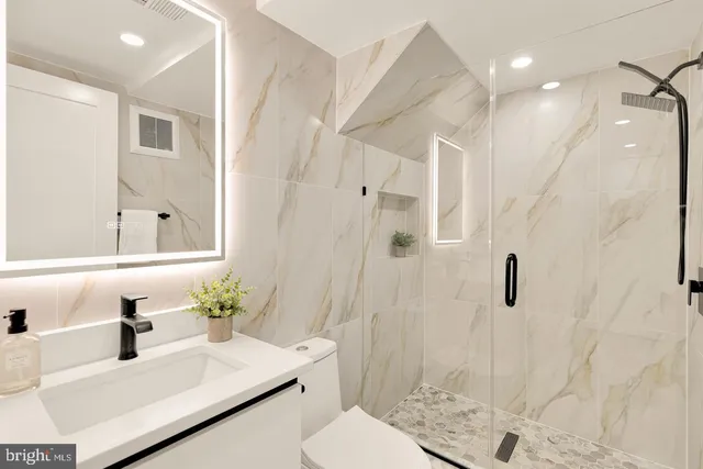 a bedroom with a large bed and a large window