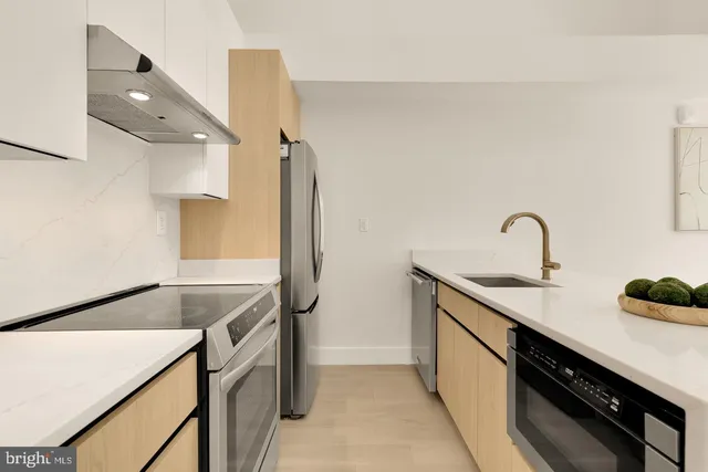 a kitchen with a sink and cabinets