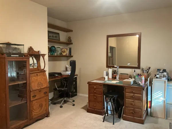 a view of a workspace with furniture