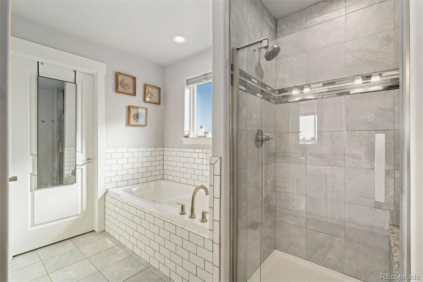16477 Stoneleigh Road Platteville, CO 80651 - Photo 20 of 37 a bathroom with a bathtub and a shower