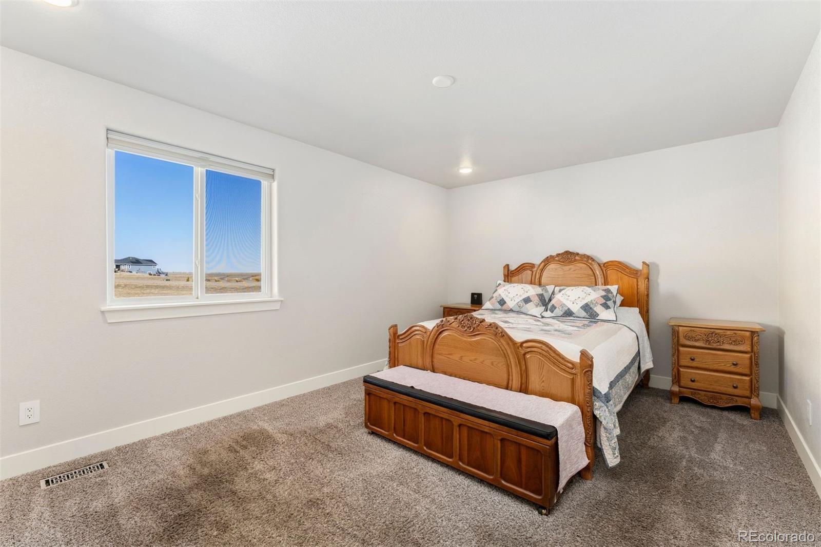 16477 Stoneleigh Road Platteville, CO 80651 - Photo 23 of 37 a bedroom with a bed and a window