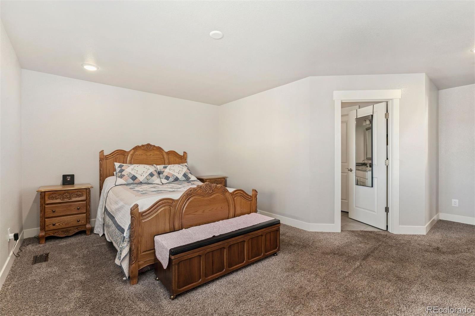 16477 Stoneleigh Road Platteville, CO 80651 - Photo 24 of 37 a bedroom with a bed and a window