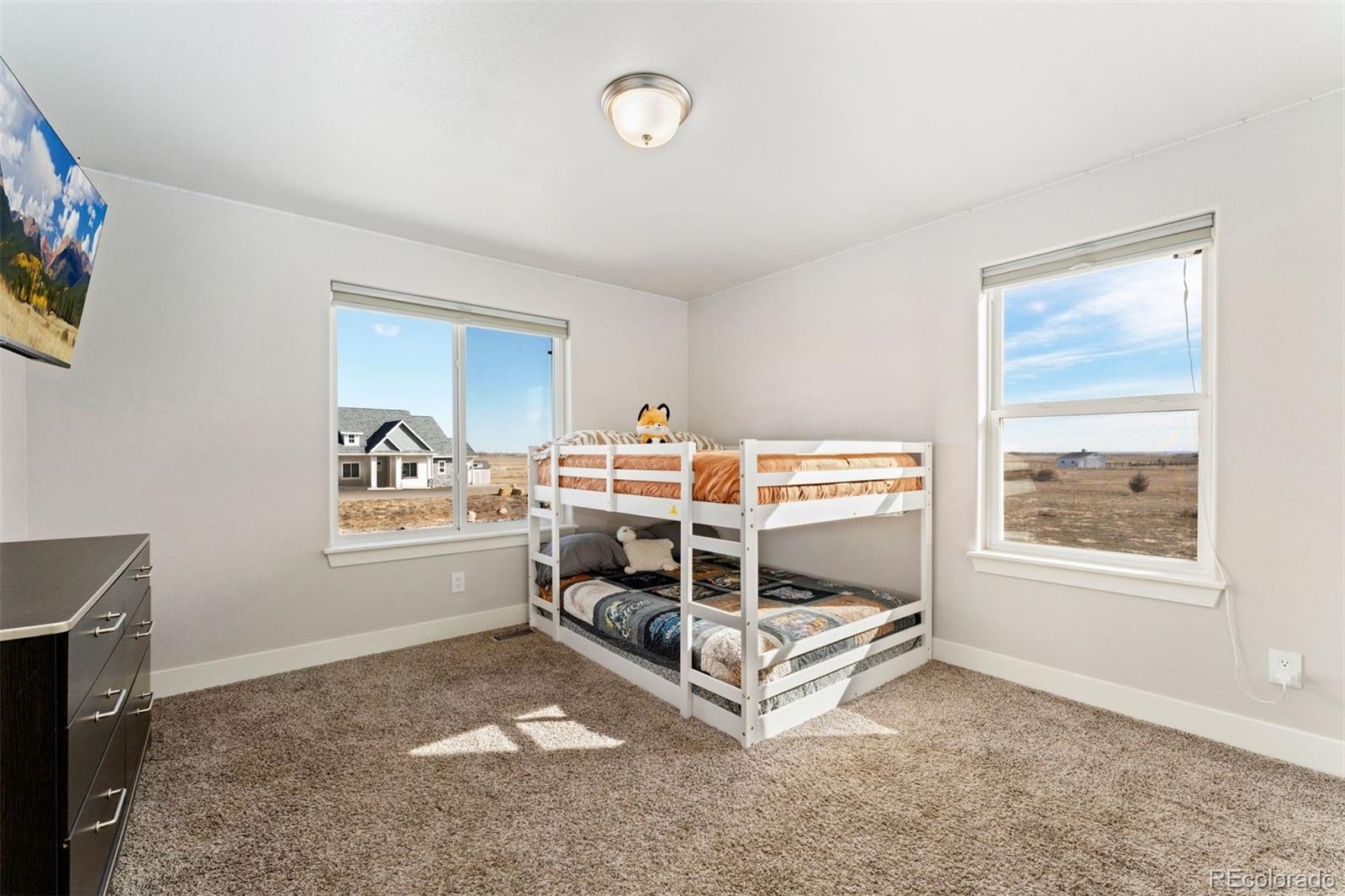 16477 Stoneleigh Road Platteville, CO 80651 - Photo 28 of 37 a room with a bed and a window