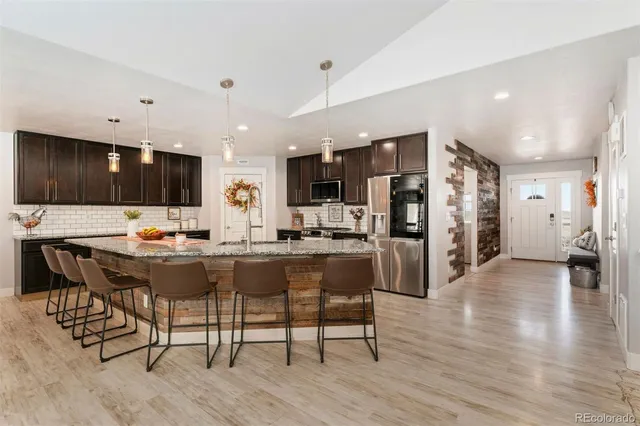 a view of a dining area with furniture and wooden floor