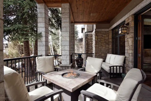 a balcony view with a seating space