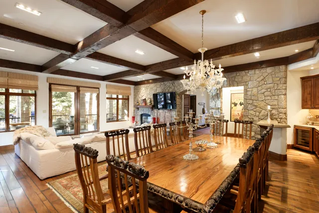 a view of a dining room with furniture wooden floor and chandelier