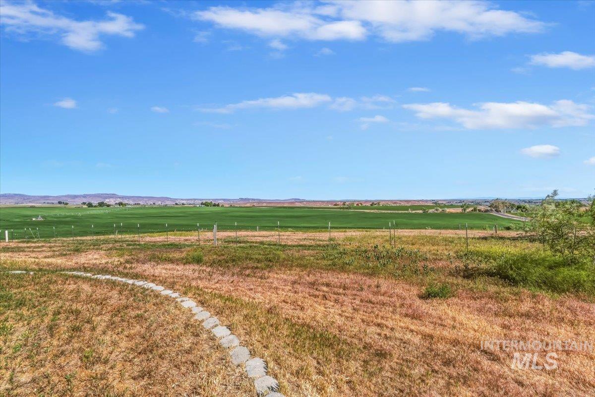 2331 Gulley Road Homedale, ID 83628 - Photo 41 of 46 Expansive rural property featuring a paved stone pathway, an agricultural field, and distant hills