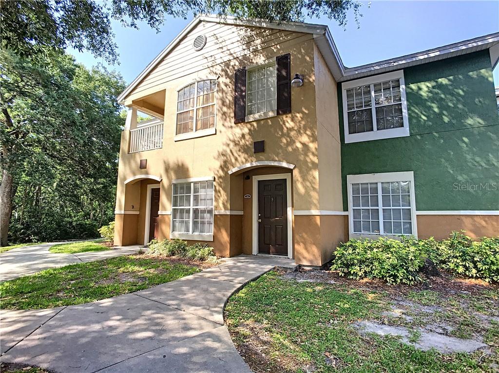 4364 South Kirkman Road, Unit 3 Orlando, FL 32811 - Photo 1 of 1 front view of a house with a yard