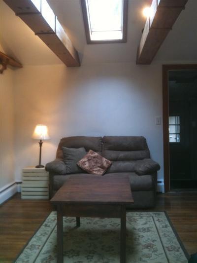 205 Lincoln Road Hyannis, MA 02601 - Photo 2 of 10 a living room with furniture and wooden floor