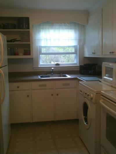 205 Lincoln Road Hyannis, MA 02601 - Photo 5 of 10 a utility room with cabinets washer and dryer