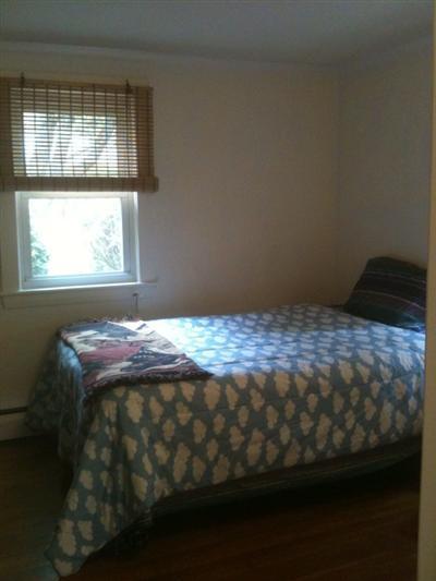 205 Lincoln Road Hyannis, MA 02601 - Photo 9 of 10 a bedroom with a bed and a window