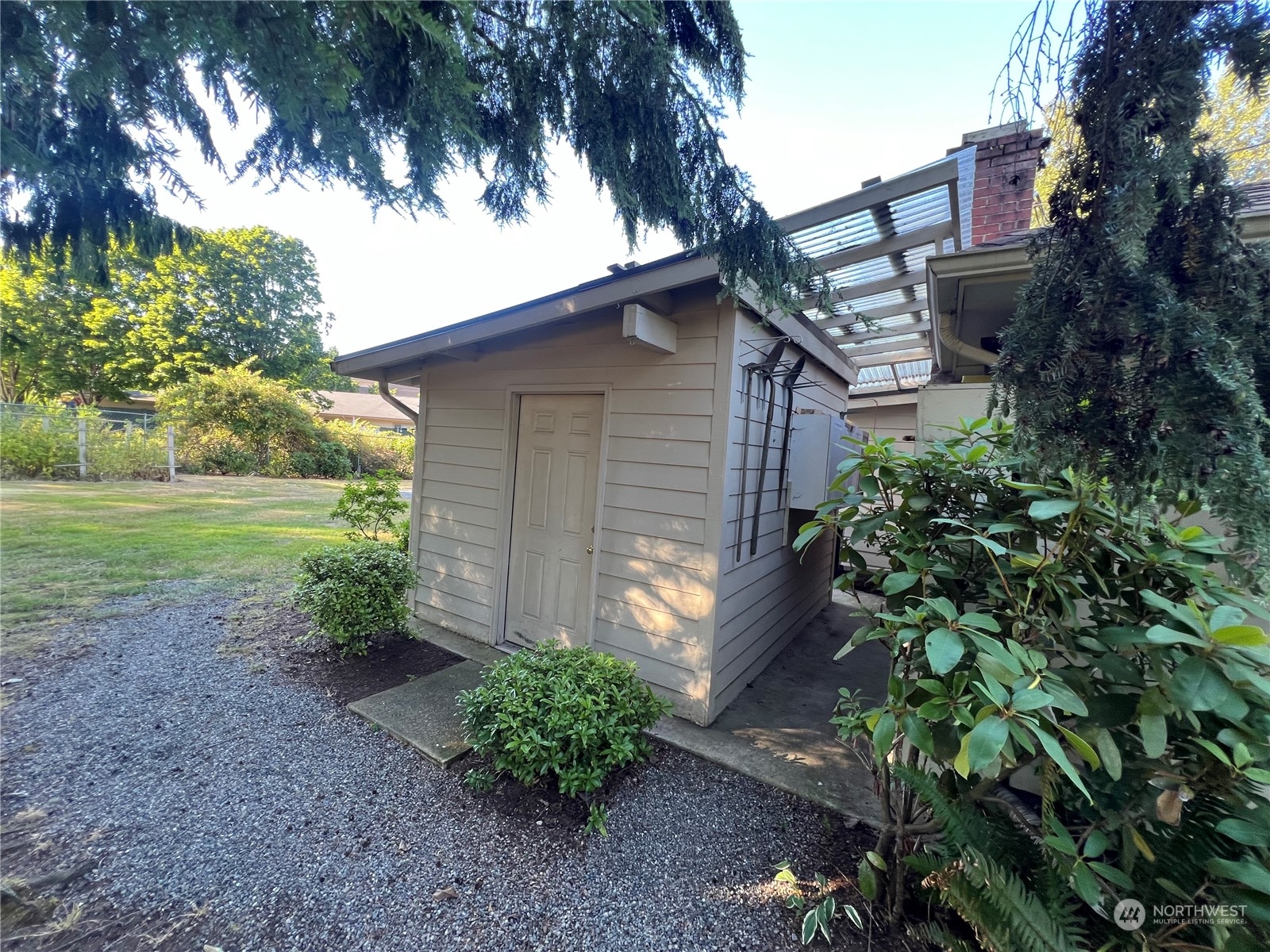 17244 Southeast Wax Road Covington, WA 98042 - Photo 28 of 30 a backyard of a house with plants and trees