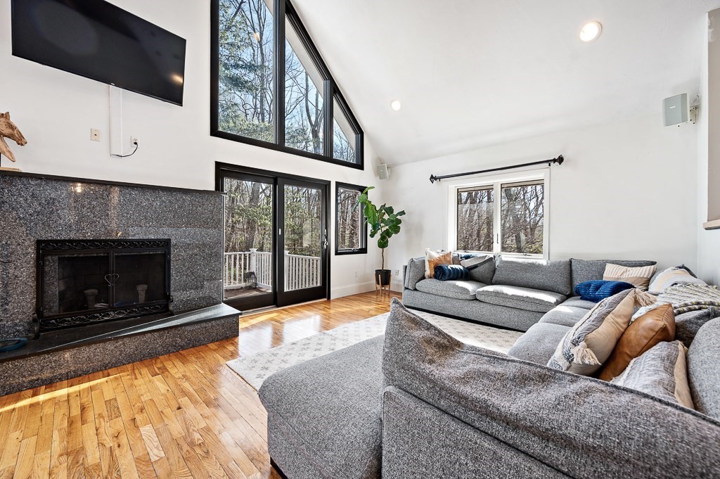 51 Pierce Road Sutton, MA 01590 - Photo 6 of 42 a living room with furniture large window and a fireplace