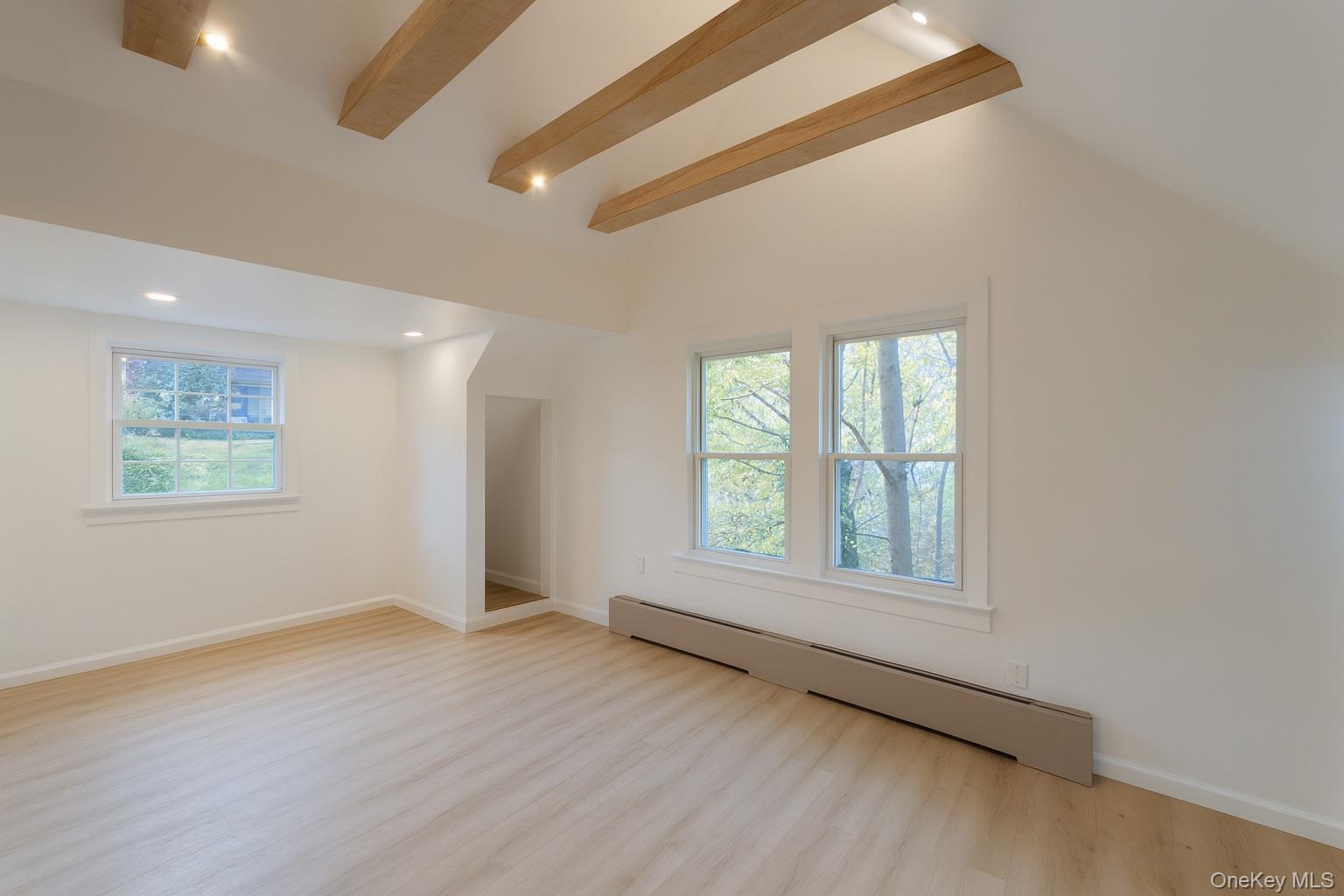 88 Cold Spring Road Liberty, NY 12754 - Photo 19 of 32 Top level bedroom featuring beamed ceiling, a baseboard radiator, light wood finished floors, and recessed lighting