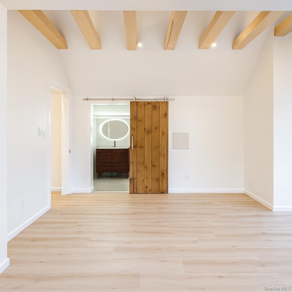 88 Cold Spring Road Liberty, NY 12754 - Photo 24 of 32 Primary bedroom with full bath and light wood-style floors and recessed lighting