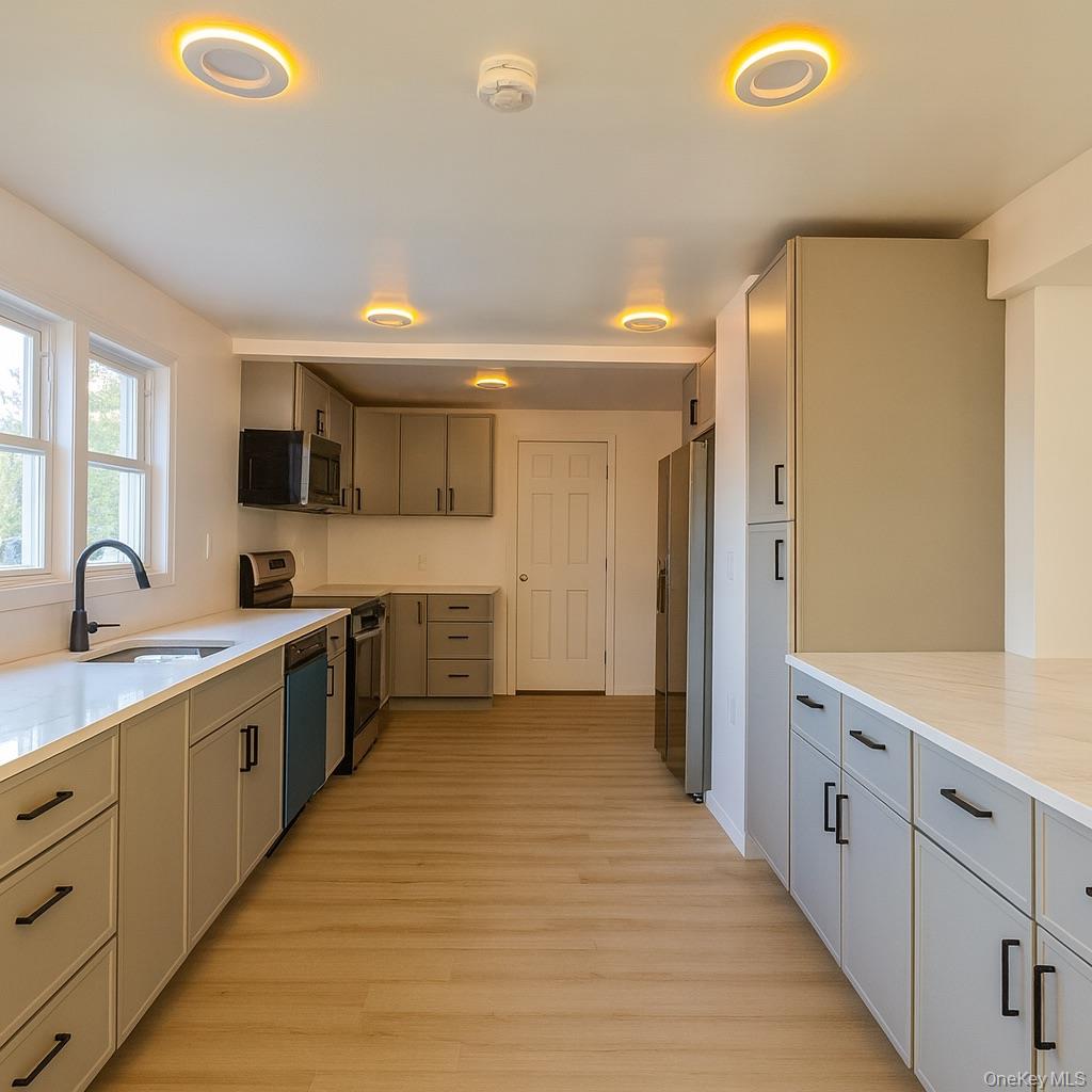 88 Cold Spring Road Liberty, NY 12754 - Photo 5 of 28 a large bathroom with a double vanity sink and a mirror